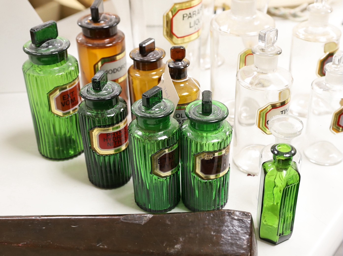 A collection of apothecary bottles, two measures and files, tallest bottle 27cms high